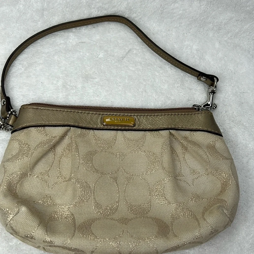Coach signature C, gold wristlet, approximate 7 x 4